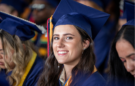 a graduate with a commencement cap