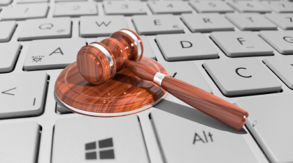 a gavel on a computer laptop