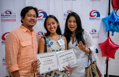 student and parents at scholarship dinner