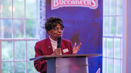 Dr. Gaba speaking at athletics luncheon
