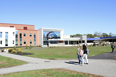 Students being escorted across campus by campus security.