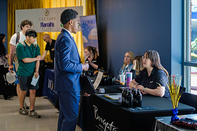 Students gathered around tables at Atlantic Cape transfer fair.