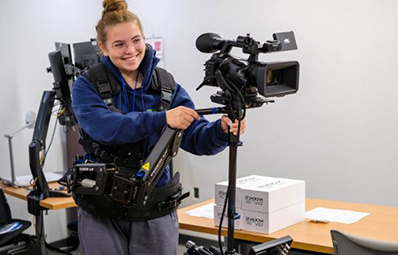 student with camera