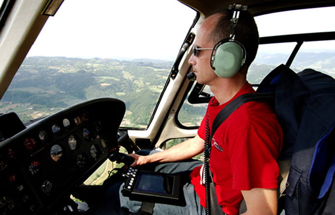 Student in the cockpit of a helicopter.