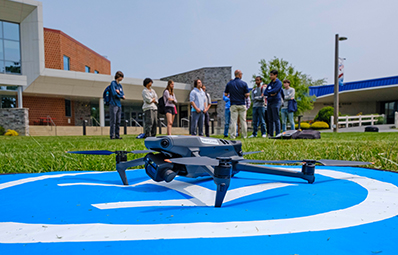 A drone on the take off/landing pad in the Quad.
