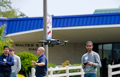 Students operating drones in the Quad.