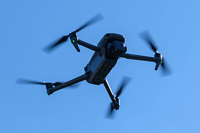 Photo of drone flying in the sky.