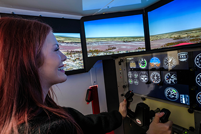 a lady at an Air Traffic Control Simulator
