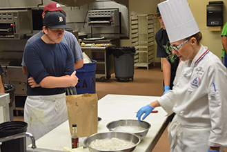chef and students in culinary workshop