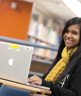 female student working on laptop