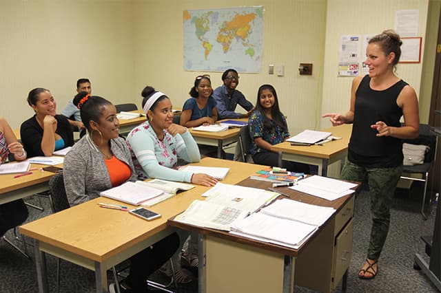 students in class with teachers