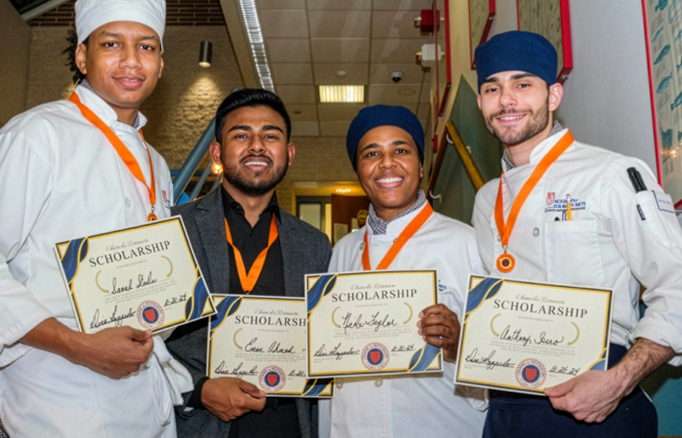 Culinary students holding up scholarships