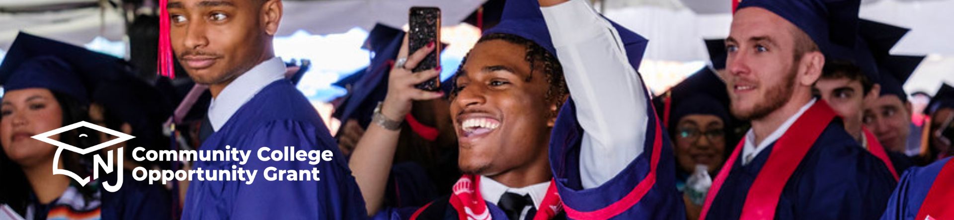 three male students at graduation