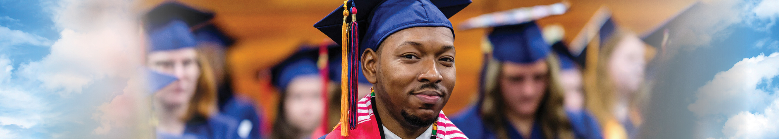 Non-traditional student in graduation cap and gown