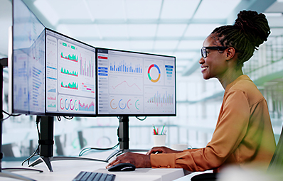 Person at computer reviewing analytics.