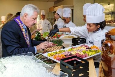 ACA student serves a guest