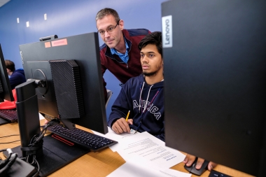 Dr. Raymond Keller instructs a student during Cyber Day