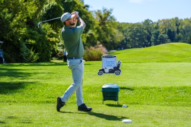 Teeing off at the annual golf tournament
