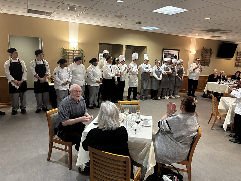 Chef Joseph Sheridan thanks the students at the 2025 Italy Dinner