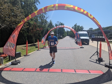 Professor Tim Cwik finishes the race