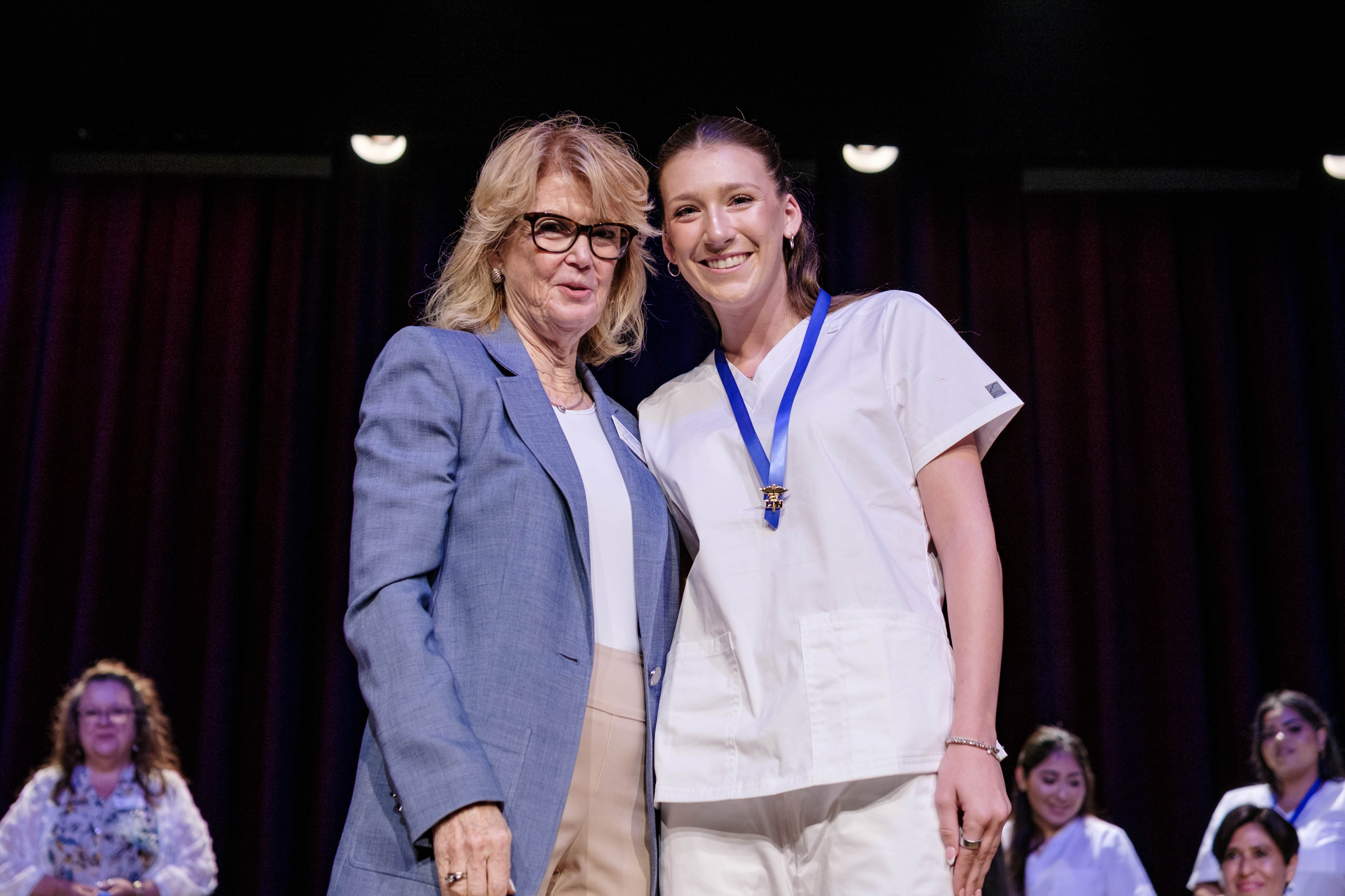 Graduate Hailee Ross receives her pin