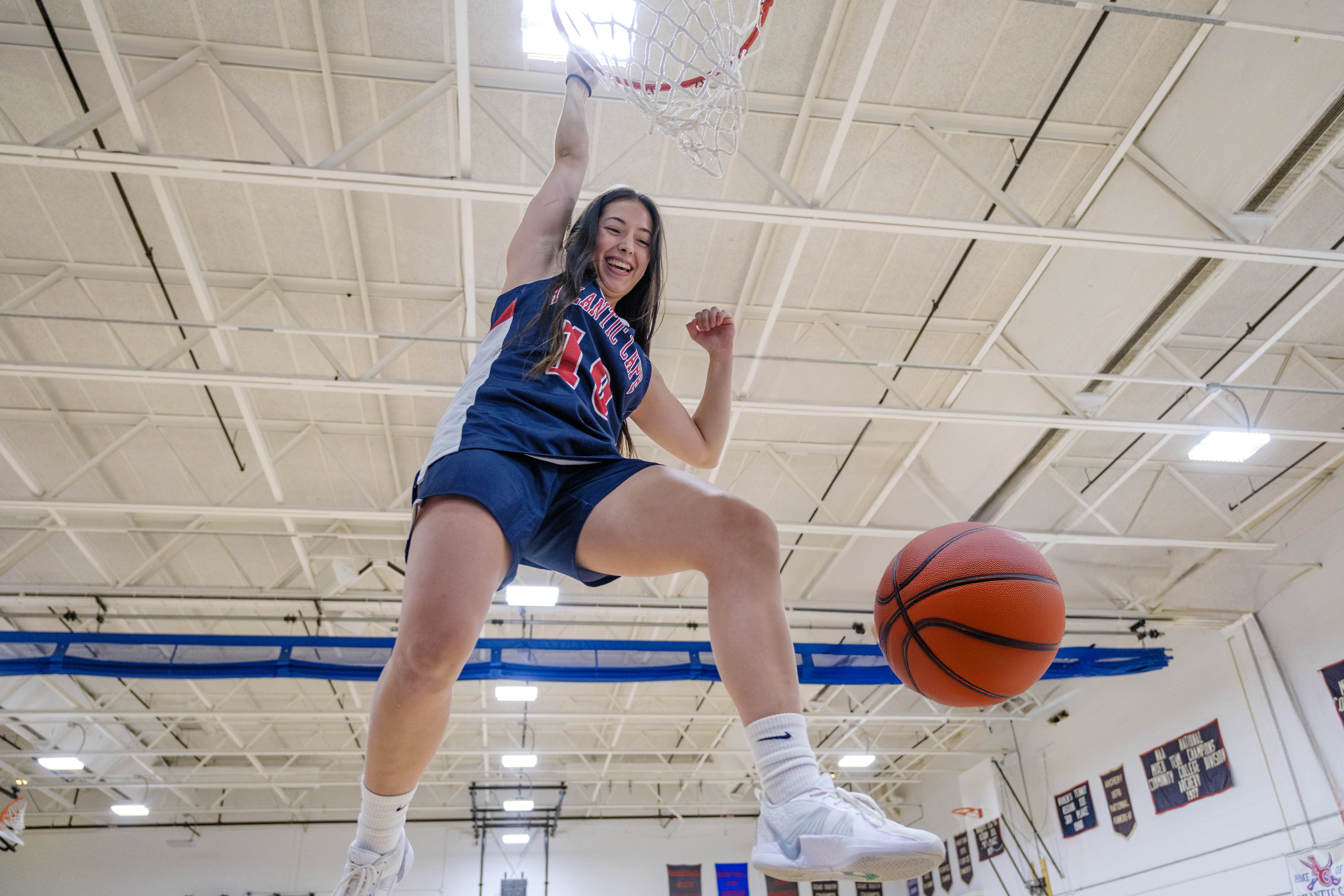 Allison Giraldo dunks the basketball
