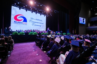 Graduates seated in front of stage at 2026 Commencement ceremony