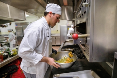 culinary student preparing chicken wings