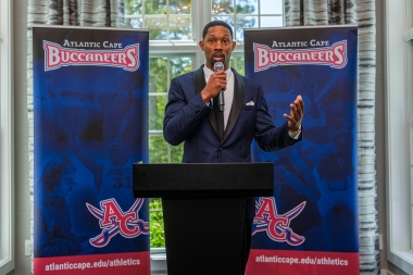 Athletic Director Jamal Edwards speak to those in attendance