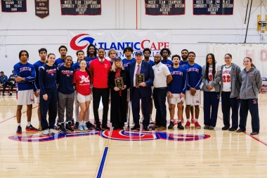 Nicholas Asselta and Nancy Small Asselta with men's and women's basketball student-athletes