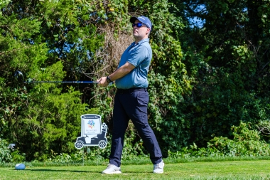 golfer tees off