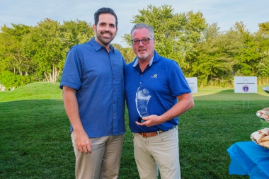 Atlantic Cape President Dr. Jason Abreu presents award to Ken Calemmo of Cooper Levenson