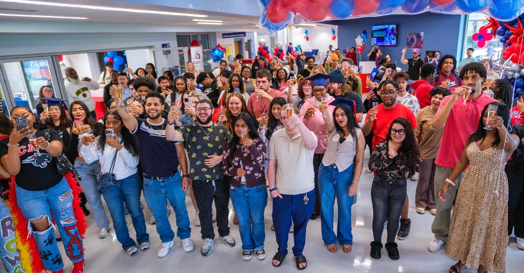 Students perform a celebratory toast at the 2026 Grad Fair
