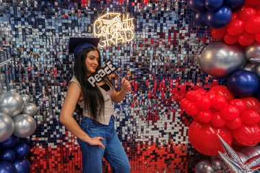 Students posing for informal photos at Grad Fair 2026