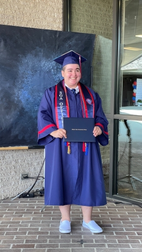 Grey Cubano receiving his diploma in 2021