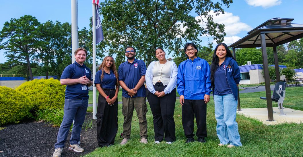 Members of student government, student engagement and Los Latinos Unidos at Hispanic Heritage Month flag raising ceremony