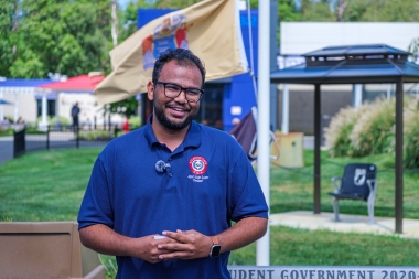 Student Government Association President Jayed Sourov speaks at flag raising ceremony