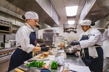 Jimenez and Gonzalez Alegria prepare their dish