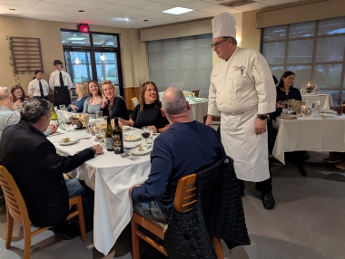 Chef Joseph Sheridan greets guests to the Italy Dinner fundraiser