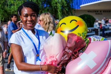 Nursing program graduate is all smiles