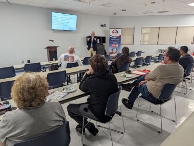 Professor James Taggart speaks to the attendees