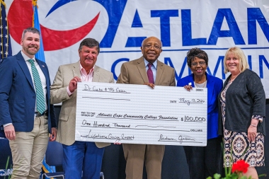 Dr. Gaba and husband, Peter, present check to the Foundation