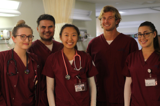 a group of nurses stand together