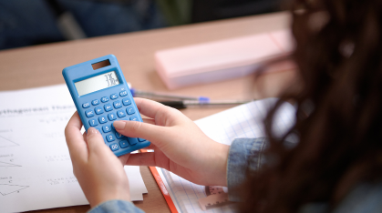 student using a calculator