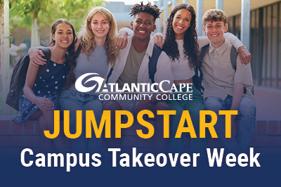 Group of students in front of the student center on the Mays Landing campus.