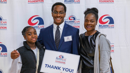 student receiving a scholarship