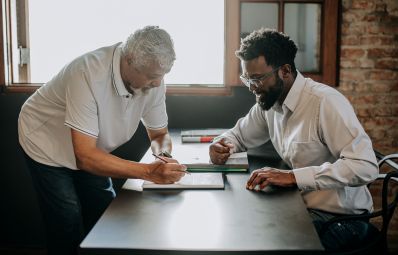 two men working on a problem