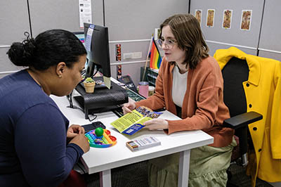 An advisor assisting a student.