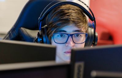 student staring at two computer screens