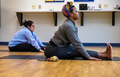 picture of two students doing yoga
